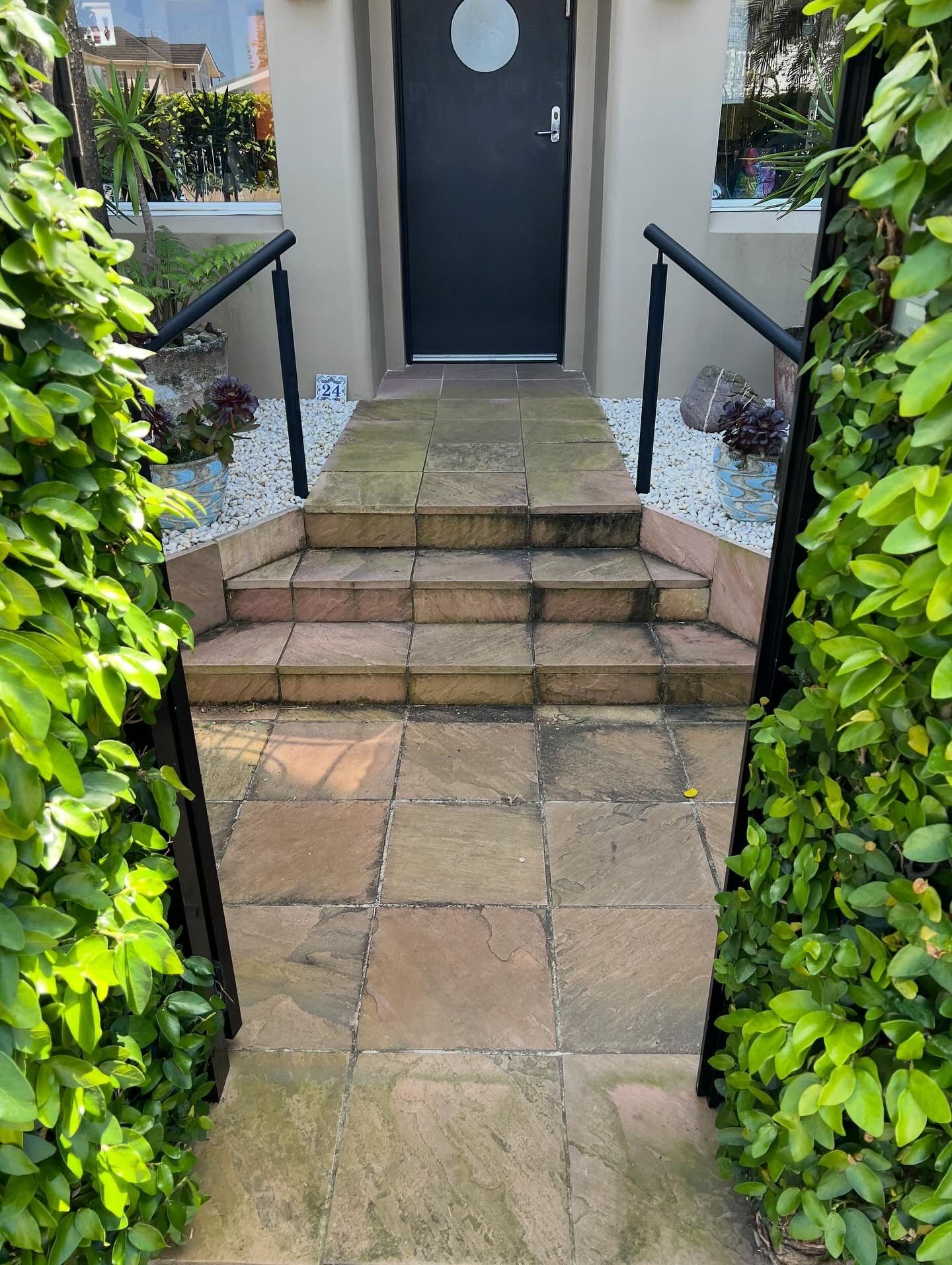 Sandstone steps and front path before a high pressure clean